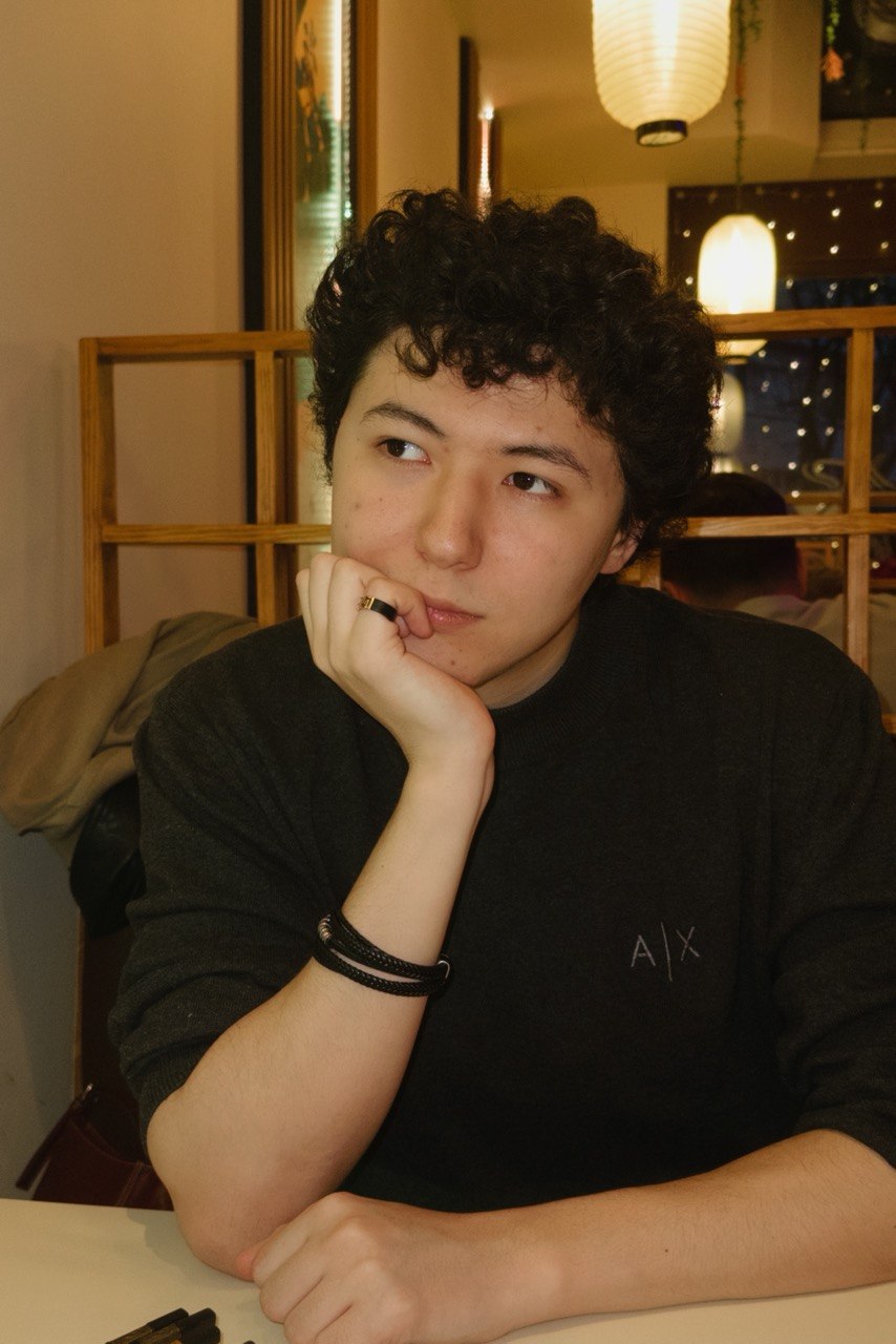 Olzhas at a cafe
